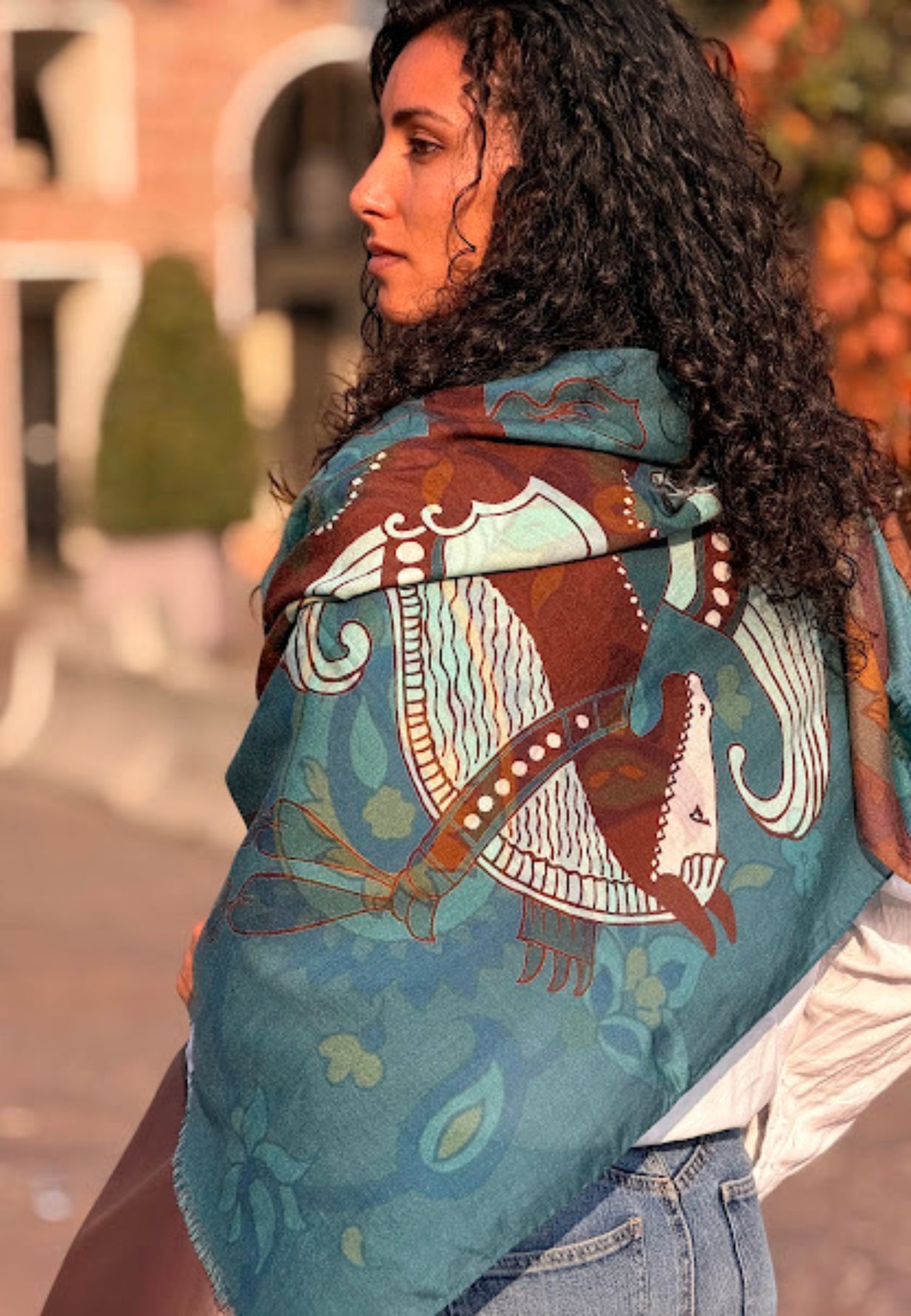 Woman wearing a colorful patterned scarf outdoors, Made in Italy  : Material : Mix of Cashmere Wool Silk